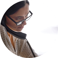 Photo of a woman using a telephone